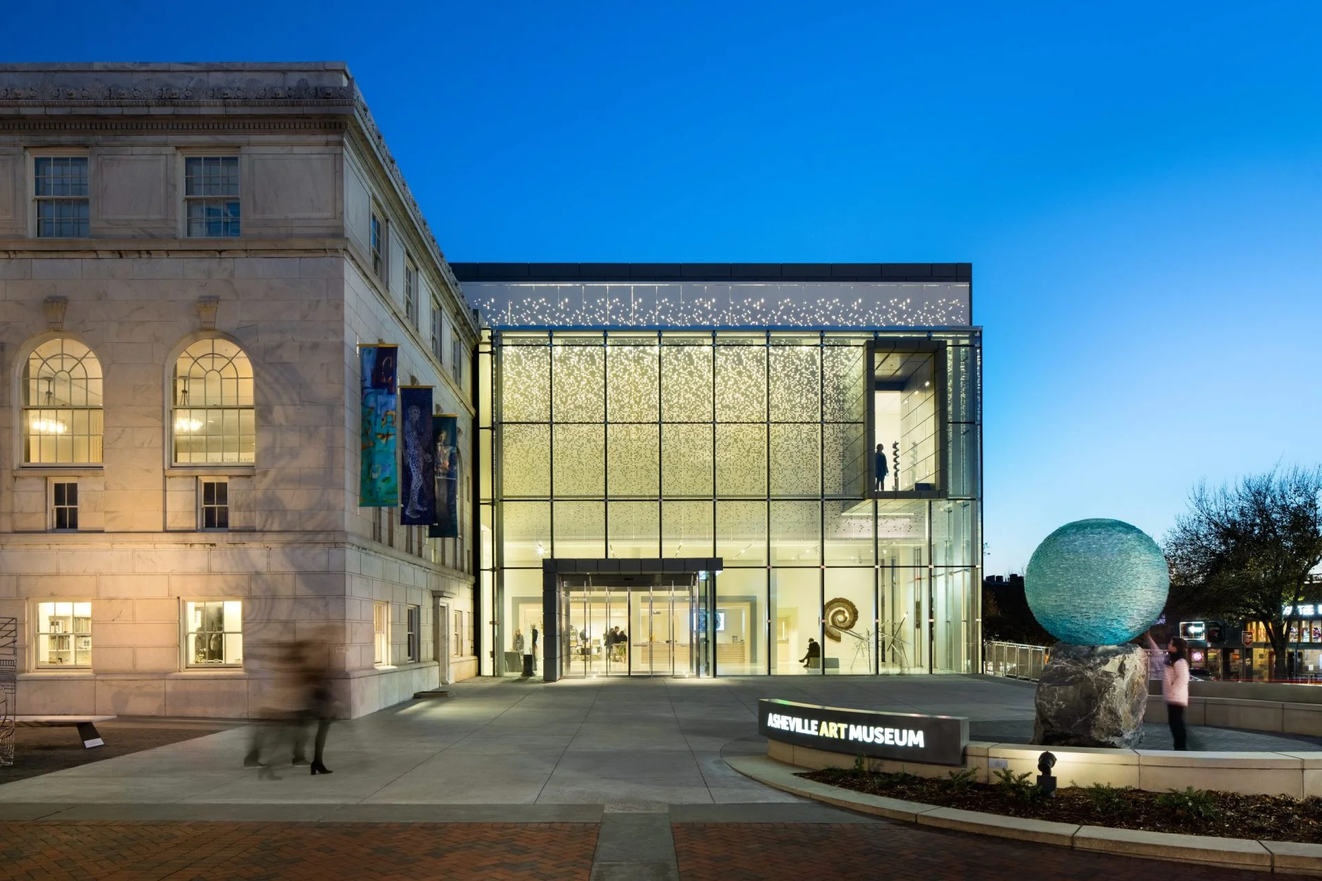 Asheville Art Museum glass facade at dusk